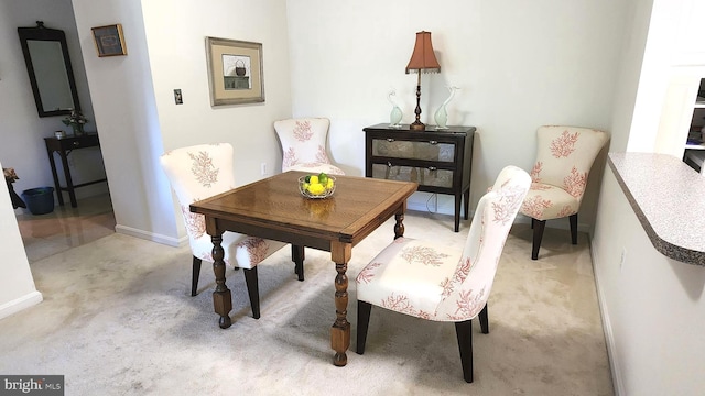 sitting room featuring light colored carpet