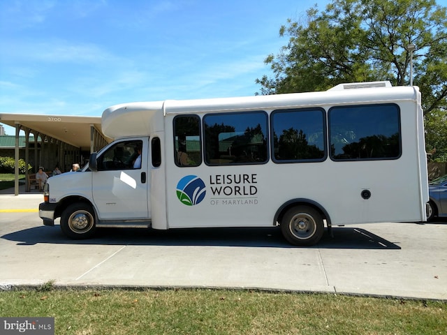 view of vehicle parking with a carport