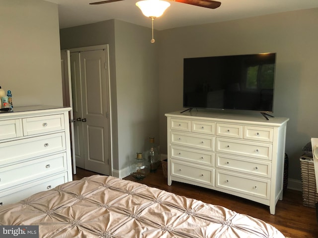 bedroom with ceiling fan and dark wood-type flooring