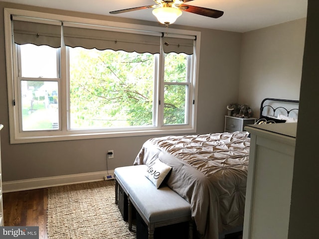 bedroom with ceiling fan and wood-type flooring