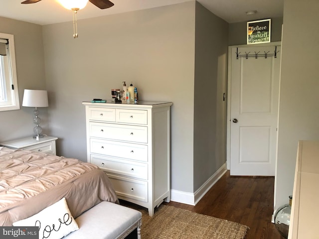 bedroom with ceiling fan and dark wood-type flooring