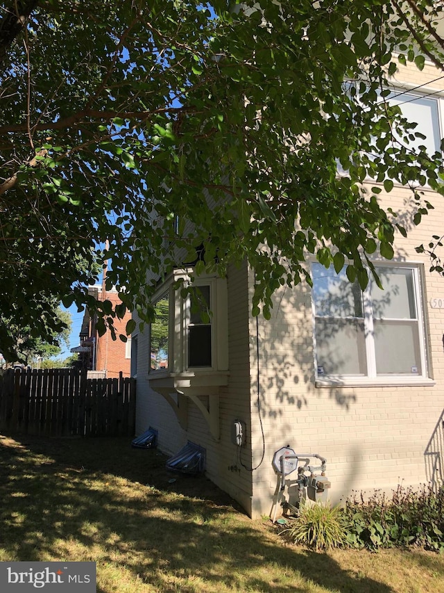 view of side of home featuring a lawn