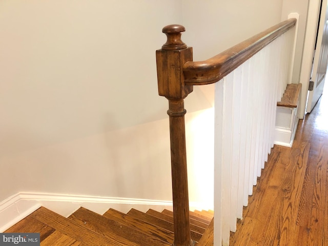 staircase featuring hardwood / wood-style flooring