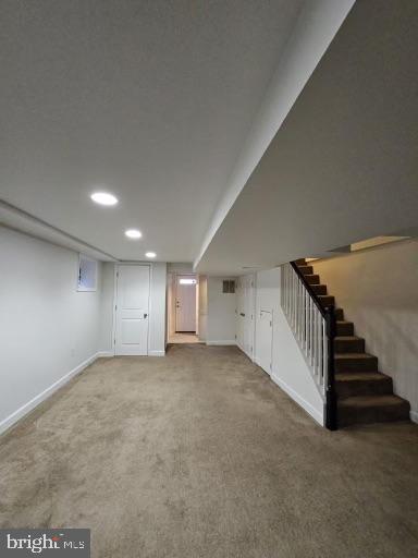 basement featuring carpet flooring