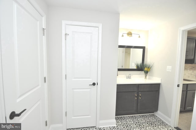 bathroom with tile patterned flooring and vanity