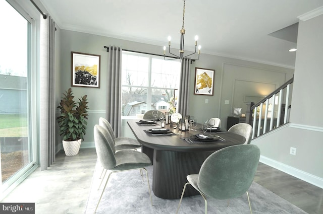 dining space featuring a wealth of natural light, crown molding, and a chandelier