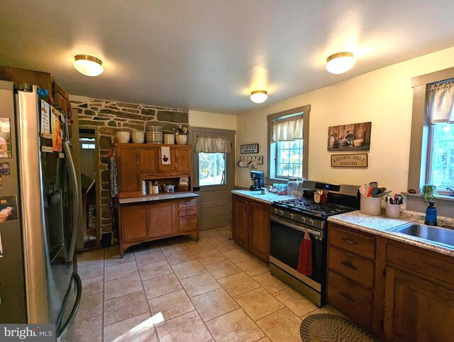 kitchen featuring a healthy amount of sunlight, stainless steel appliances, and sink