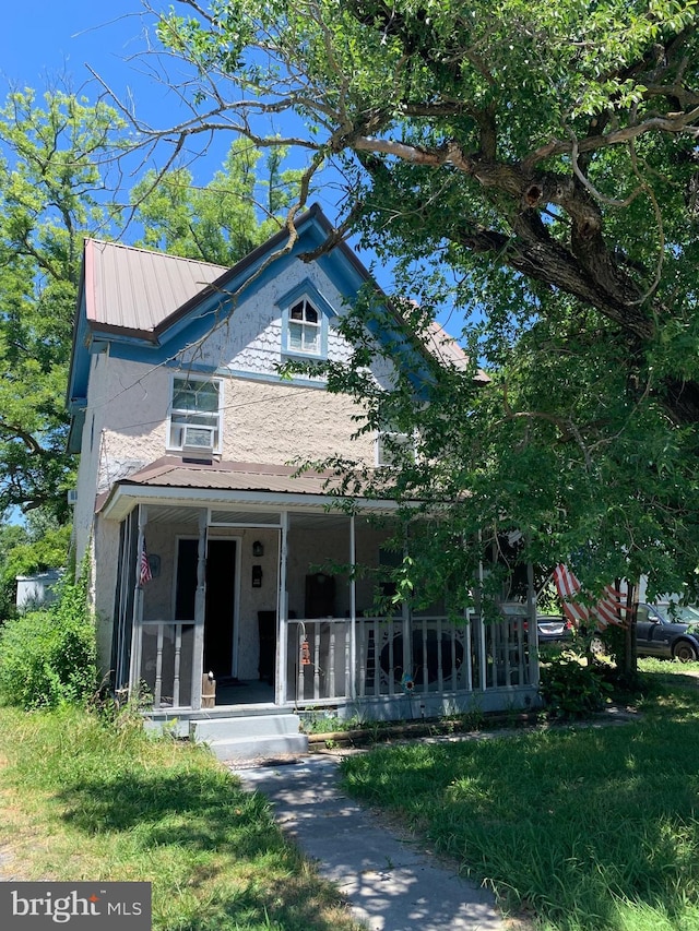 view of front of home featuring covered porch