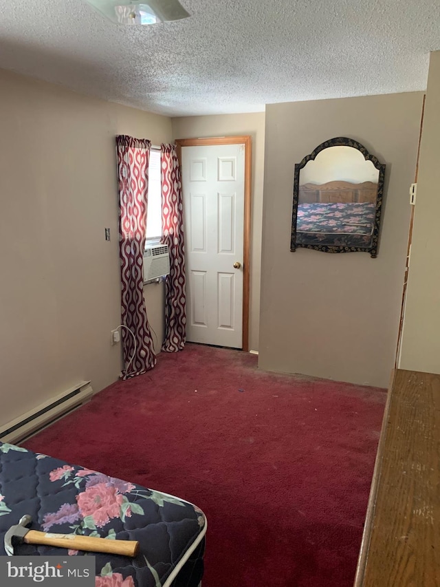 carpeted bedroom with cooling unit, a baseboard radiator, and a textured ceiling