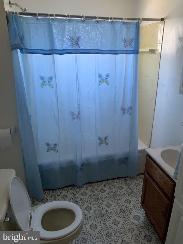 full bathroom with shower / bath combo, toilet, and vanity