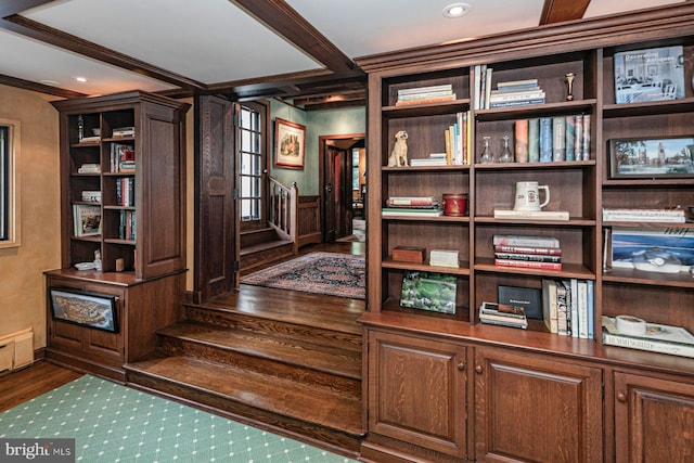 interior space featuring wood-type flooring and ornamental molding