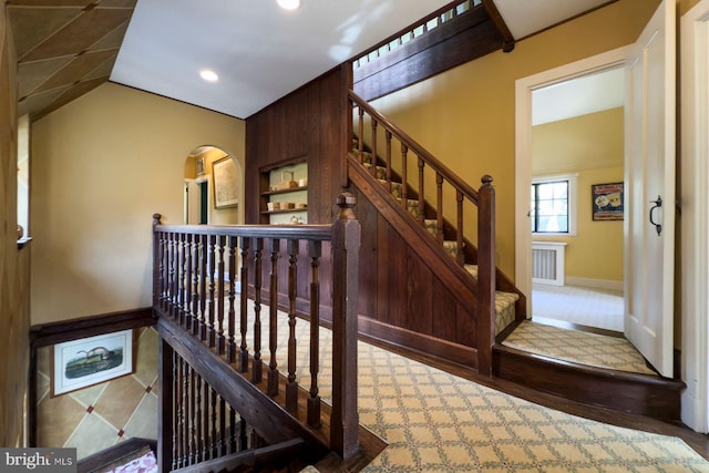 stairs with lofted ceiling