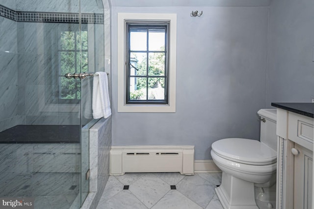 bathroom with vanity, baseboard heating, toilet, and an enclosed shower