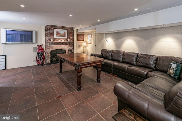 tiled living room with a brick fireplace