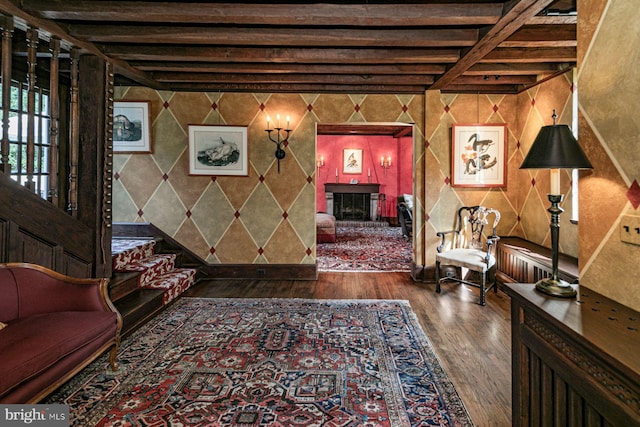 living room with beamed ceiling and hardwood / wood-style flooring