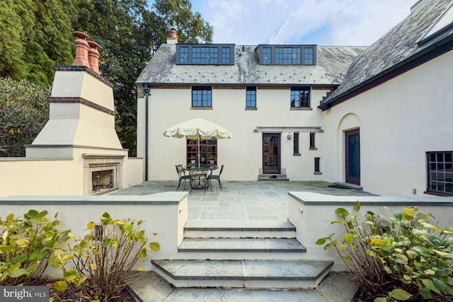 rear view of house with a patio area