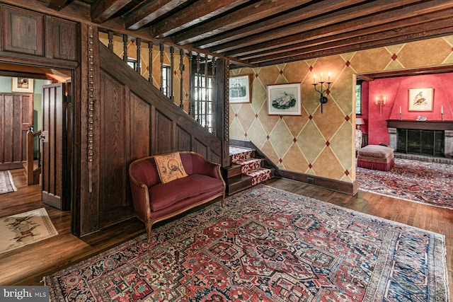 interior space featuring beam ceiling and dark wood-type flooring