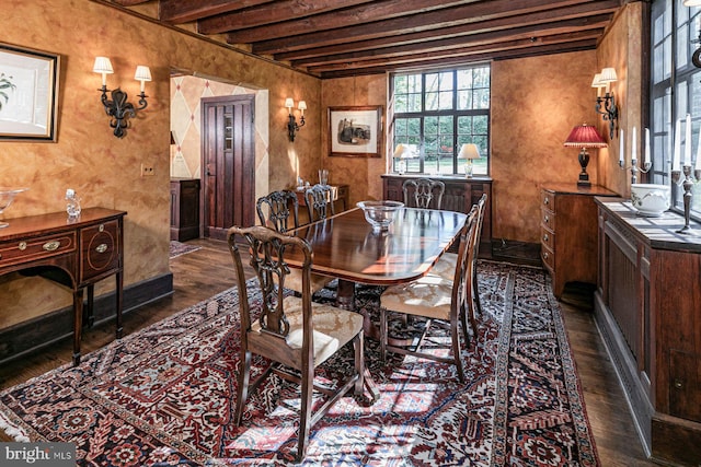 dining room featuring beam ceiling and dark hardwood / wood-style flooring