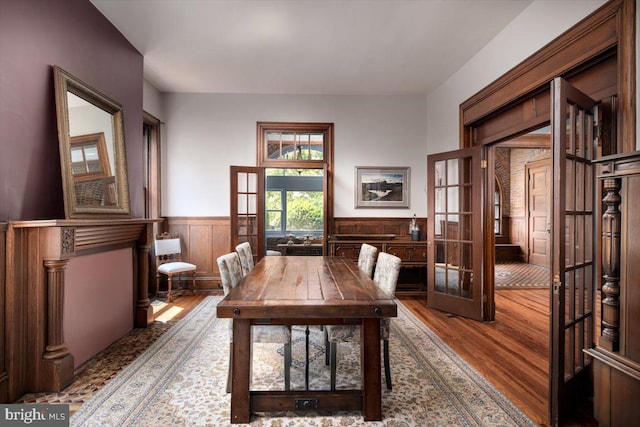 dining area featuring french doors and hardwood / wood-style floors