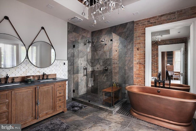 bathroom featuring vanity and independent shower and bath