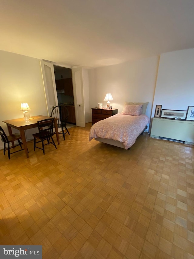 bedroom featuring light parquet flooring