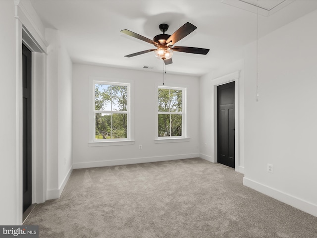 unfurnished bedroom featuring light carpet and ceiling fan