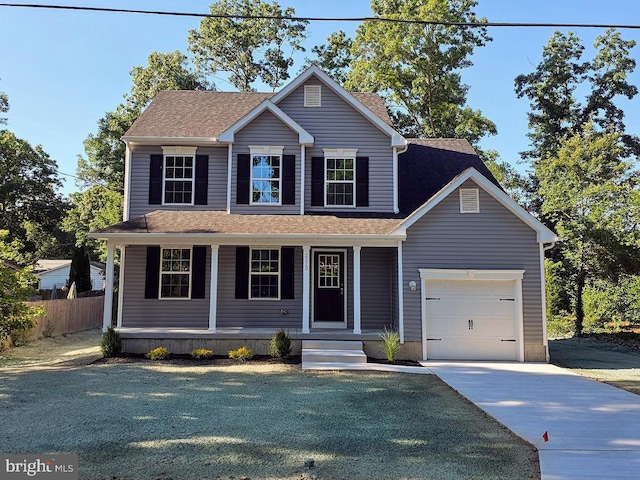 view of front of home with a porch and a garage