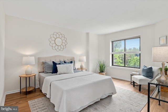 bedroom with hardwood / wood-style floors