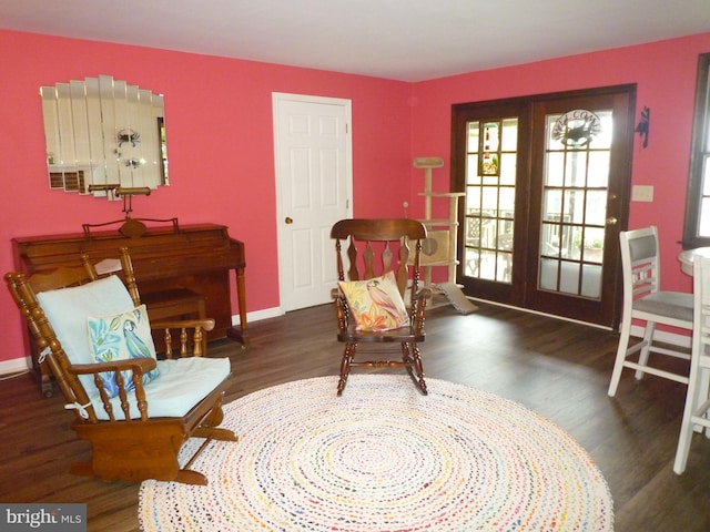 sitting room with dark hardwood / wood-style flooring