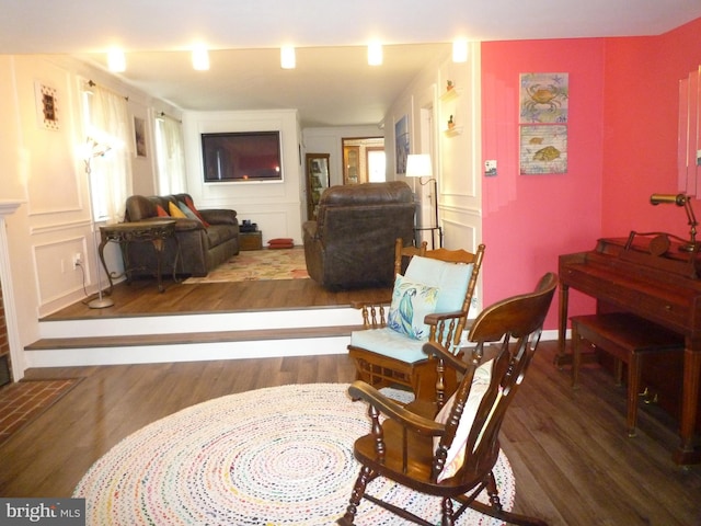 living area featuring hardwood / wood-style floors