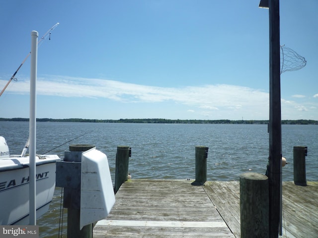 view of dock with a water view