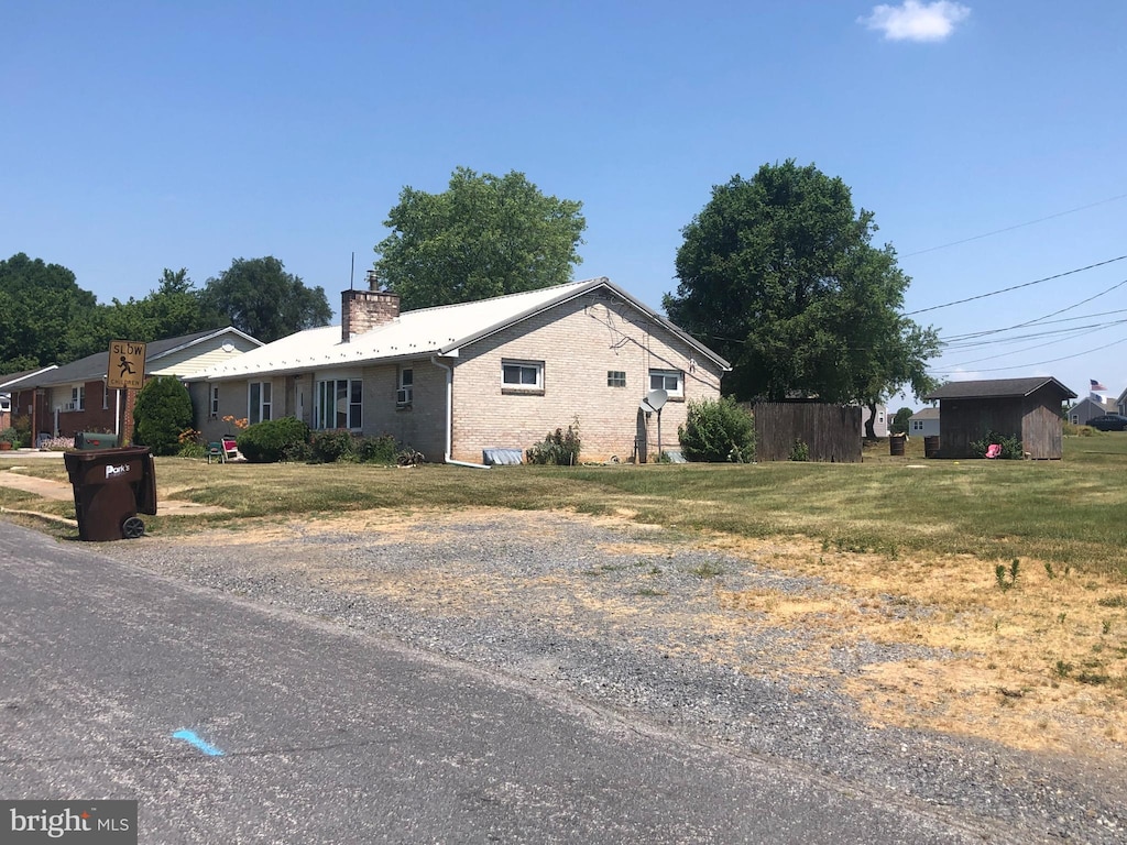 view of home's exterior with a lawn