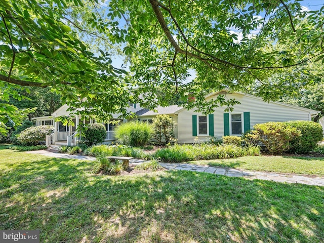 view of yard with covered porch