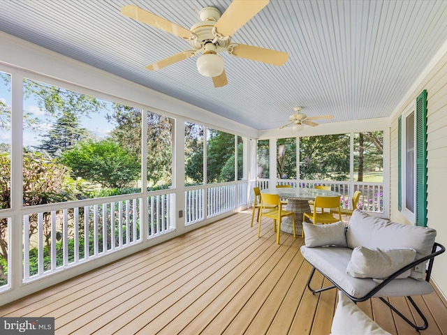 sunroom / solarium with ceiling fan and a wealth of natural light