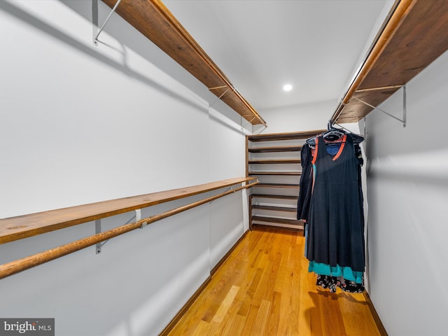 walk in closet featuring light hardwood / wood-style floors