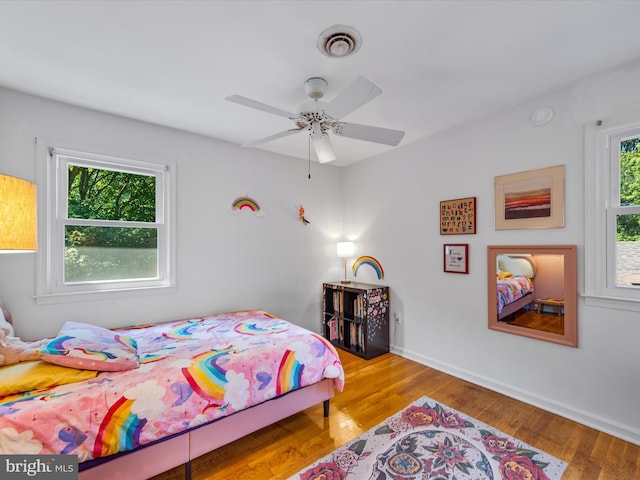 bedroom with ceiling fan and light wood-type flooring