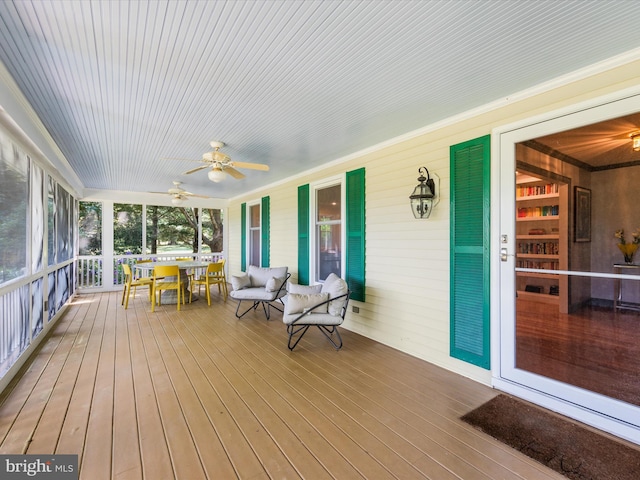 wooden terrace with ceiling fan and a porch