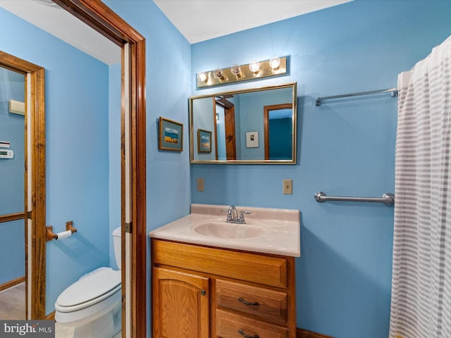 bathroom with vanity and toilet