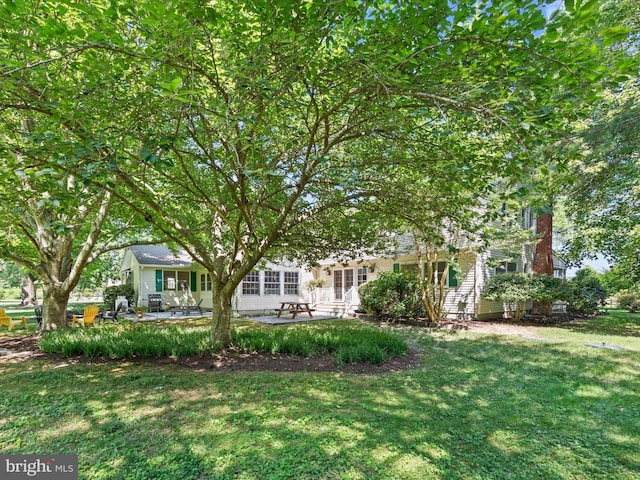 view of yard with a patio and french doors