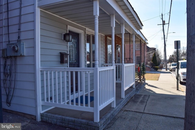 view of property exterior with a porch