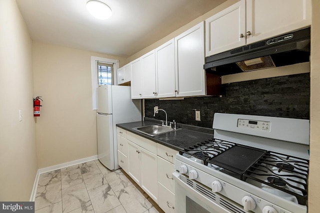 kitchen with white appliances, backsplash, white cabinetry, and sink