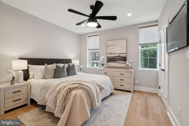 bedroom featuring ceiling fan and light wood-type flooring