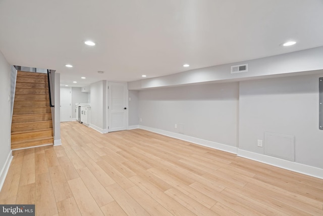 basement featuring light wood-type flooring