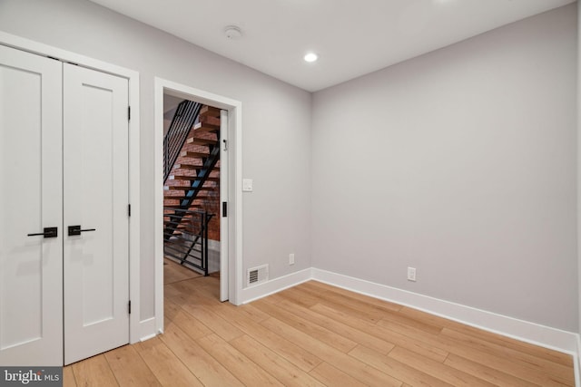 empty room with light wood-type flooring