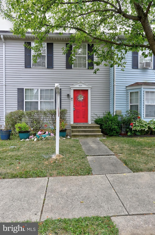 view of front of home with a front lawn