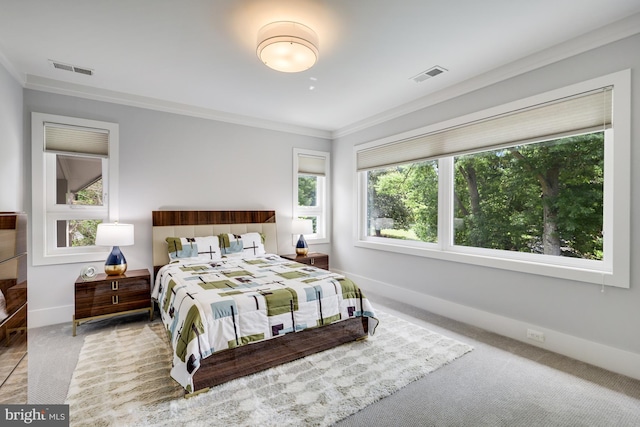 carpeted bedroom featuring ornamental molding