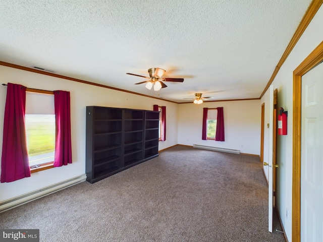 interior space featuring crown molding, a baseboard heating unit, and a textured ceiling