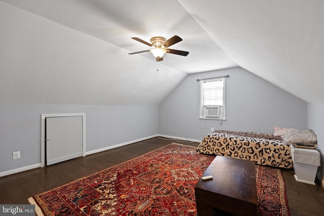 bedroom with dark hardwood / wood-style floors, vaulted ceiling, ceiling fan, and cooling unit