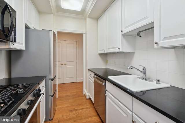 kitchen with white cabinetry, ornamental molding, dishwasher, and sink