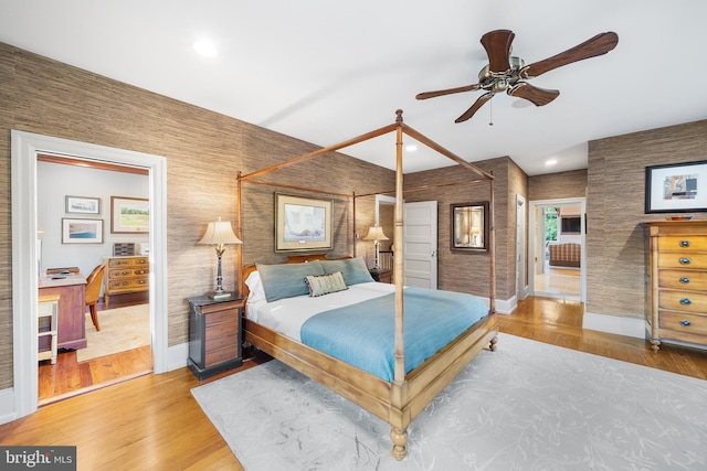 bedroom with hardwood / wood-style floors and ceiling fan